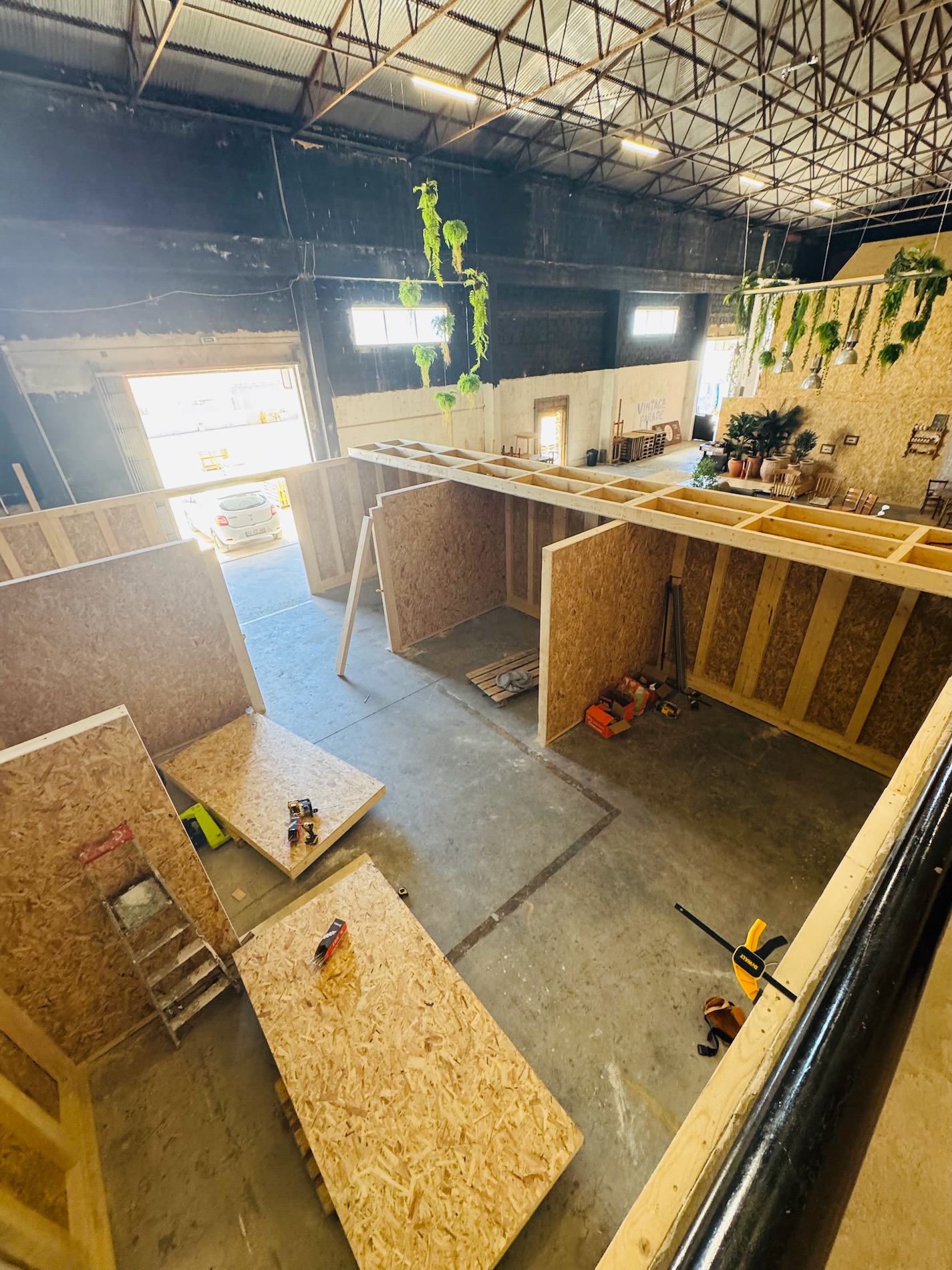 High view of timber workshop walls being built inside Laco Hub